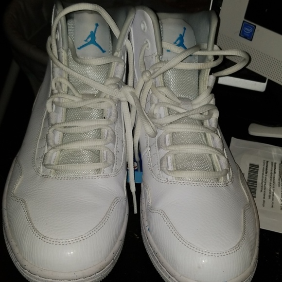 white jordans with blue bottom